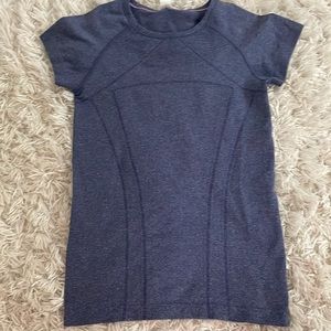 Ivivia tshirt that is blue, barely worn